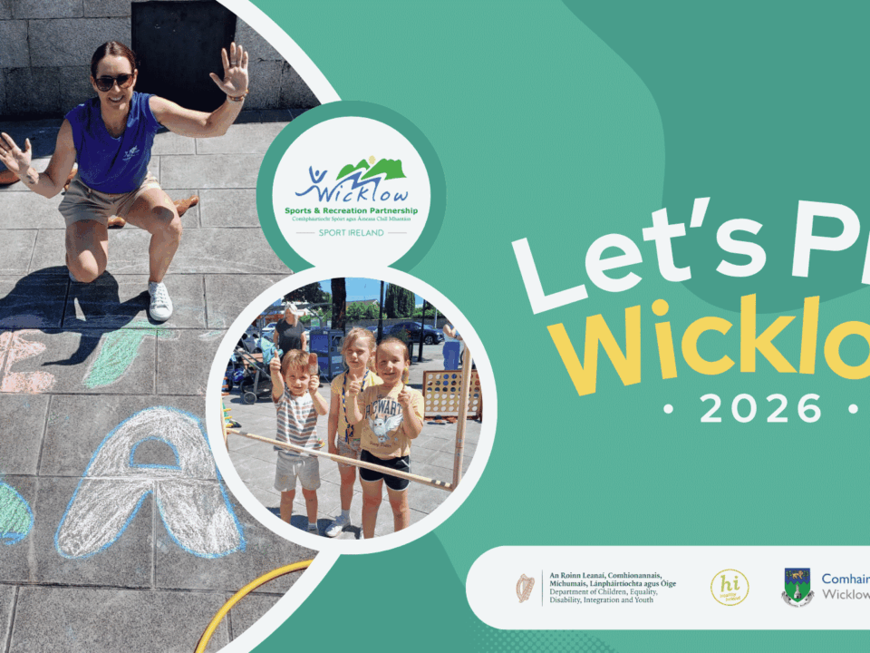 Promotional graphic for Let's Play Wicklow 2026. On the left, an outdoor event photo shows an instructor crouching over large chalk drawings on the pavement, and a circular inset photo shows three young children smiling outdoors. The right side features a green background with the text: Let's Play Wicklow 2026. Partner logos at the bottom include Wicklow Sports and Recreation Partnership, the Department of Children, Equality, Disability, Integration and Youth, Healthy Wicklow, and Wicklow County Council.